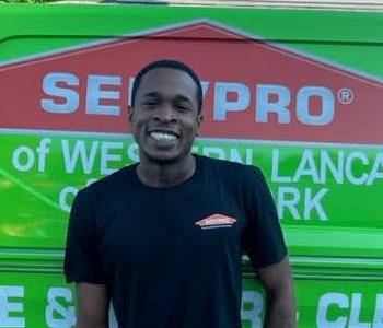 Nate Greennagh in front of SERVPRO van