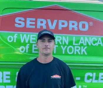 Ron Bentzel in front of SERVPRO van