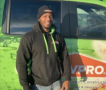 Mark standing in front of servpro van