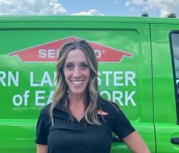 Amy Levin in front of SERVPRO van