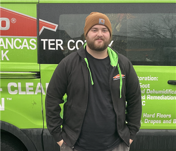 frank standing in front of servpro van