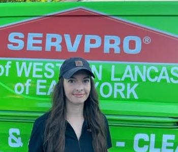 Brenna Elliot in front of SERVPRO van