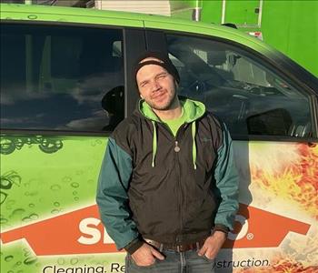 John standing in front of servpro van