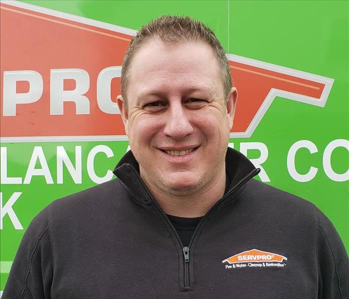Business development manager in front of SERVPRO logo
